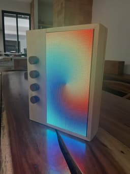 Alfredo Borboa's Patternflow in a pale wood case, a full-spectrum gradient across the panel