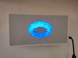 A blue ring pattern on day's Raspberry Pi Patternflow build in a white enclosure