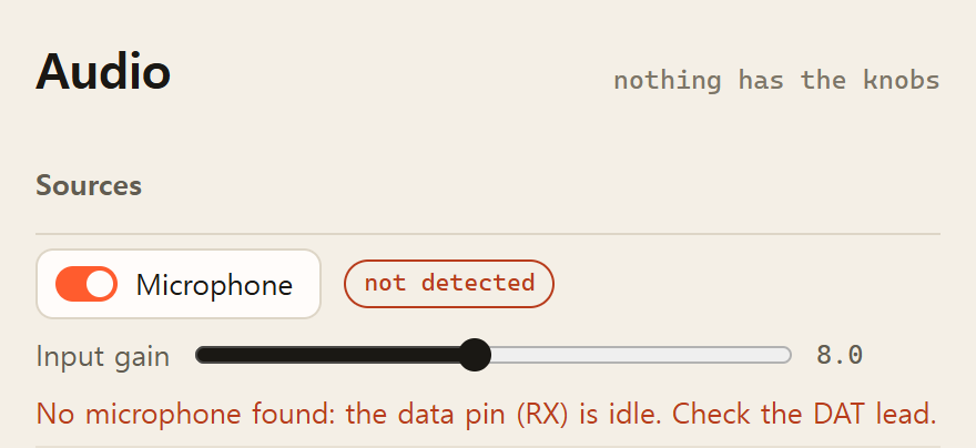 The console's Audio page: the Microphone switch is on, the chip beside it reads not detected, and the line under the Input gain slider reads No microphone found: the data pin (RX) is idle. Check the DAT lead.